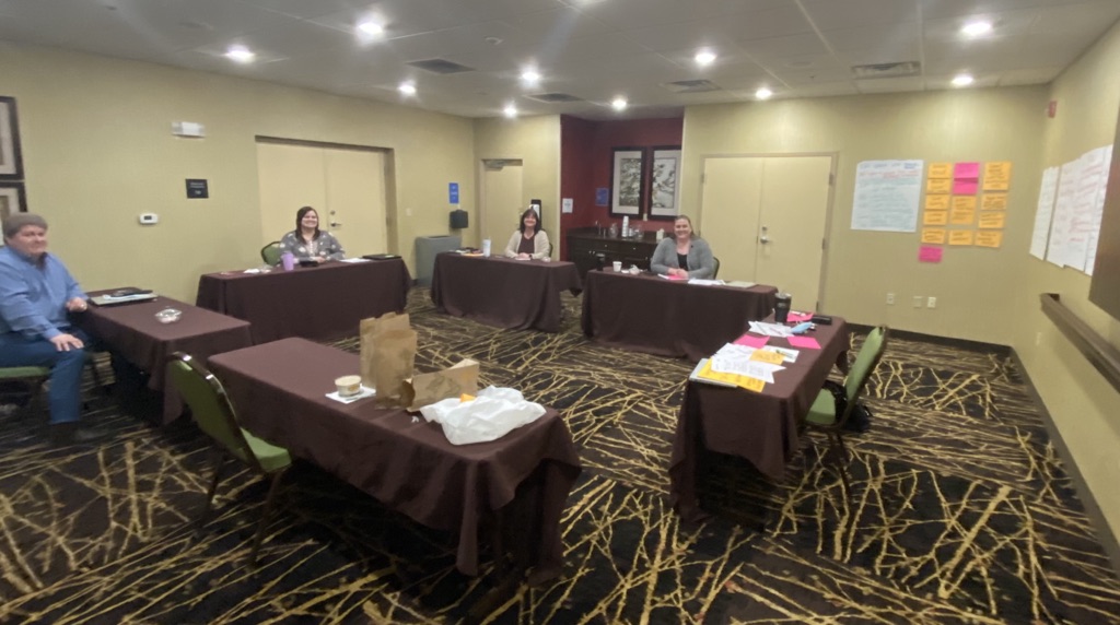 The One Focus team in a weekly EOS meeting